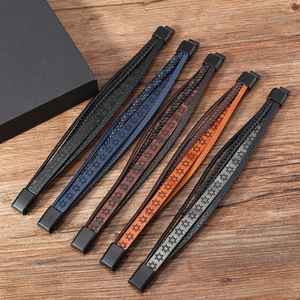 Detail view of multi-layer woven leather bracelets with hexagram pattern and magnetic clasp