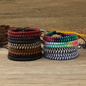 Detail of adjustable handmade braided rope bracelets in vibrant and retro color combinations