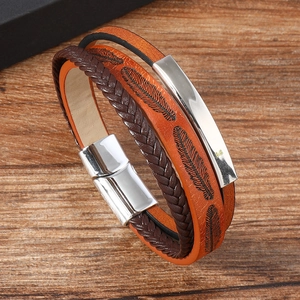 Close-up of multilayer leather bracelet featuring feather texture and magnetic clasp