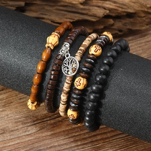 Set of four vintage wood and coconut shell beads bracelets with tree of life metal charm