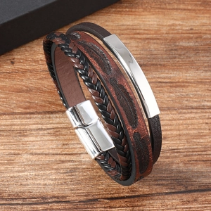 Macro view of multi-layer leather bracelet with feather embossing and magnetic metal clasp