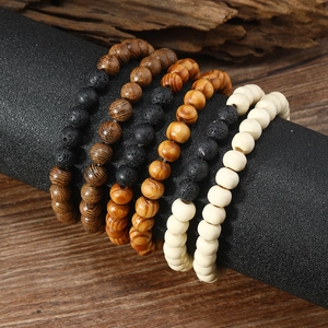 Men's 6-piece vintage lava rock and wood bead bracelet set on a natural wooden display