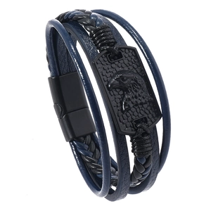 Detail of men's multilayer braided leather bracelet with eagle relief metal plaque