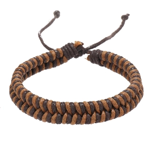 Close-up of handmade double-stranded woven rope bracelet with adjustable closure