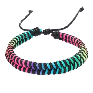 Close-up of double-strand woven bracelet with colorful nylon cords and adjustable knot