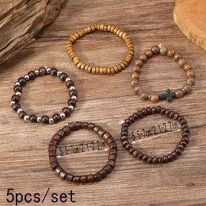 Vintage 5pcs men's wood bead bracelet set with cross charm on rustic background