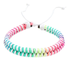 Detailed macro view of colorful hand-woven double cord bracelet with adjustable white closure