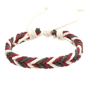 Detail of red and green braided rope bracelet with adjustable slide knot closure
