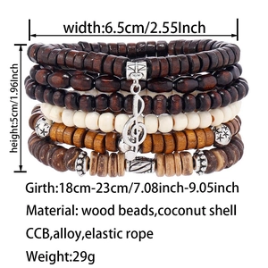 Close-up of multilayer beads bracelet with musical treble clef charm and coconut shell textures