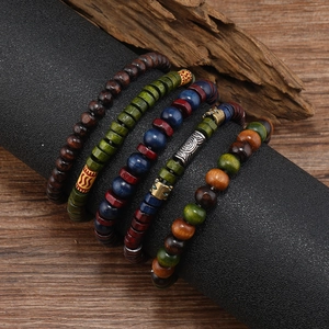 Bohemian multi-layer wooden bead bracelet set with ethnic metallic accents and earthy tones