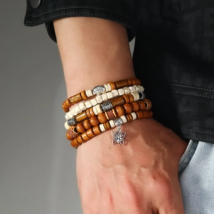 Men's multi-layer wooden bead bracelet featuring detailed butterfly and elephant charms