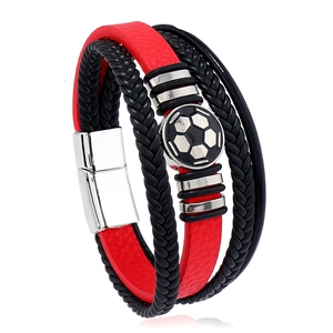 Detail of multi-layer men's braided leather bracelet with football motif and magnetic clasp