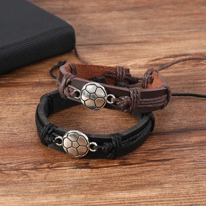 Vintage braided leather soccer bracelets for men in black and brown styles on wood