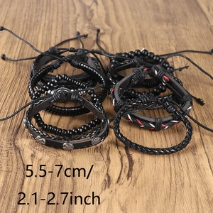 Detail of adjustable black woven leather bracelet set with size specs on wood background