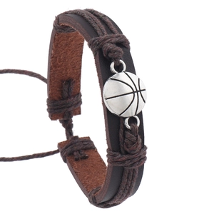 Detail of basketball charm on multi-layer braided leather bracelet with retro sports style