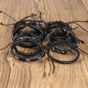 Men's retro punk braided leather bracelet set with beads and star charms on wood base
