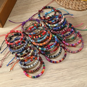 Detailed pile of colorful bohemian woven friendship bracelets with ethnic patterns