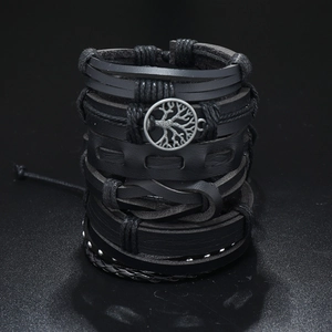 Close-up of black layered leather bracelet with silver Tree of Life charm and metal studs