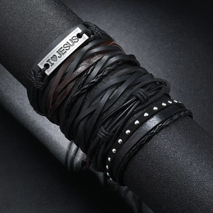 Detail of multi-layer leather bracelet featuring I LOVE JESUS metal plate and silver rivets