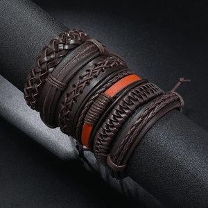 Detail of multi-layered braided leather bracelet with Tree of Life on display stand