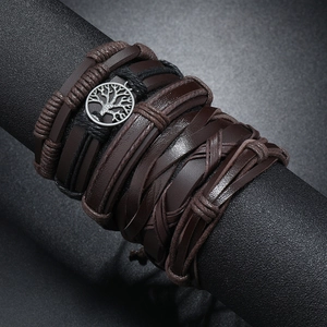 Detailed view of multilayer leather bracelet with a vintage silver Tree of Life charm