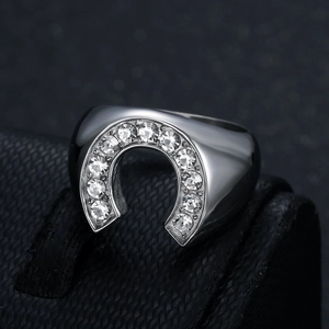 Polished silver horseshoe ring for men with 11 sparkling crystals on a textured stand