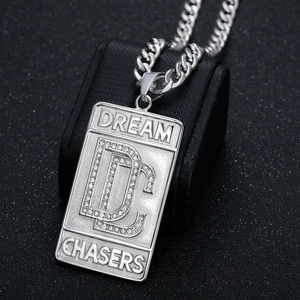 Hip hop silver steel necklace featuring iced out DC Dream Chasers pendant on Cuban chain
