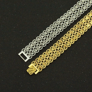 Men's wide geometric link bracelets in gold and silver finish with pyramid stud details