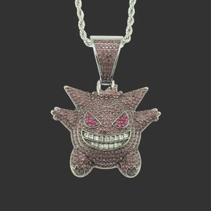 Close-up of hip hop Gengar pendant with pink crystals and silver braided rope chain