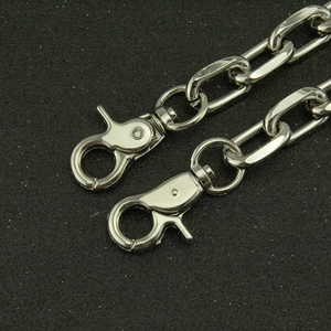 Close-up of polished silver oval link chain with two sturdy metal lobster clasps