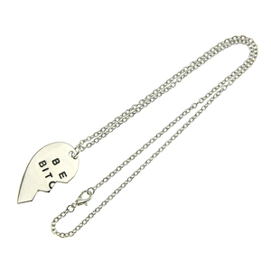 Silver split heart pendant necklace with BE and BITC engraving on white background