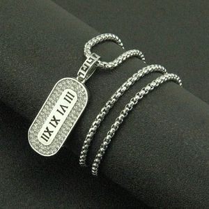 Silver roman numeral pendant necklace with pavé crystals and greek key detail chain