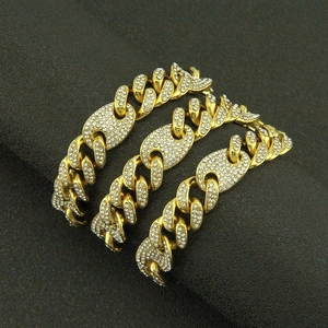 Three iced out gold mariner coffee bean link necklaces with sparkling cubic zirconia crystals