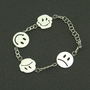 Minimalist stainless steel bracelet featuring silver smiley and sad face charms