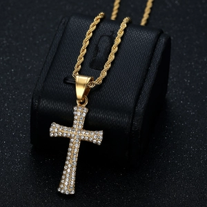 Gold plated hip hop cross necklace with sparkling rhinestones on a black rope chain