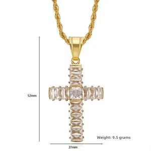 Detailed view of gold cross pendant with cubic zirconia, dimensions 52mm by 27mm