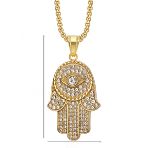 Detailed view of gold plated Hamsa pendant with pavé crystals measuring 59mm by 31mm