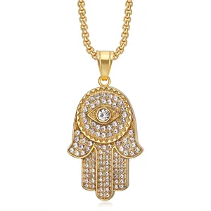 Gold plated Hamsa Hand pendant necklace with paved crystals and Evil Eye center