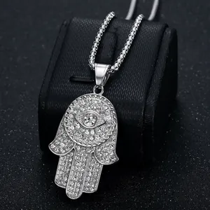 Silver Hamsa Hand pendant necklace with crystals and evil eye on black display box