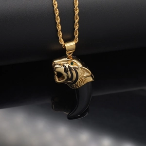 Gothic gold tiger head pendant with black resin fang on a thick twisted chain link necklace
