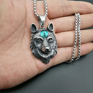 Vintage Viking wolf head pendant necklace in steel with a blue gemstone center stone