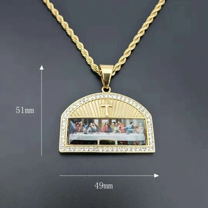 Macro view of gold-plated hip hop Last Supper pendant with white zircon stones