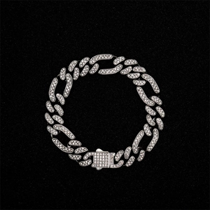 Detail of silver iced-out cuban link chain featuring a square clasp and dense stones