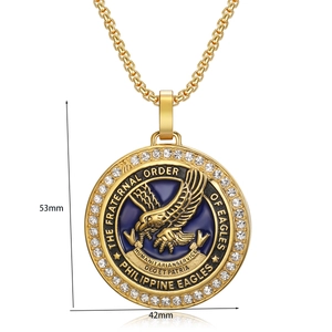 Close-up of golden eagle pendant with blue enamel, white rhinestones and dimensions