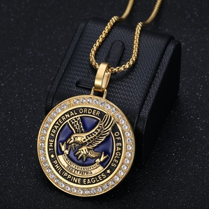 Detail of Eagle emblem pendant with blue enamel and rhinestones on gold square chain