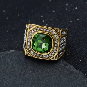 Macro shot of 316 stainless steel ring with square emerald gem and micro pave white diamonds