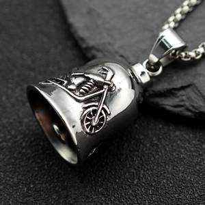 Vintage stainless steel motorcycle bell pendant with embossed design on black stone