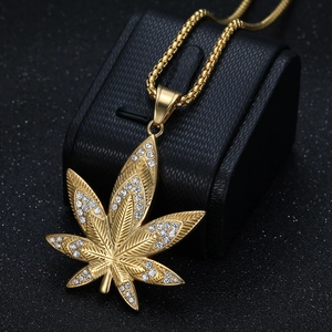 Hip-hop gold plated maple leaf pendant necklace with crystals on a black leather box