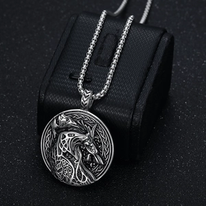 Nordic Viking wolf head pendant necklace with vintage silver relief on black stand