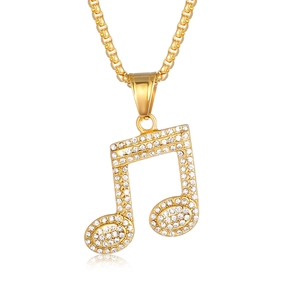 Golden musical note pendant necklace with sparkling rhinestones on a box chain